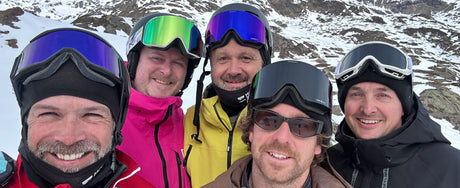 a bunch of snowboarders wearing snowboard goggles